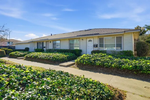 front view of a house with a yard
