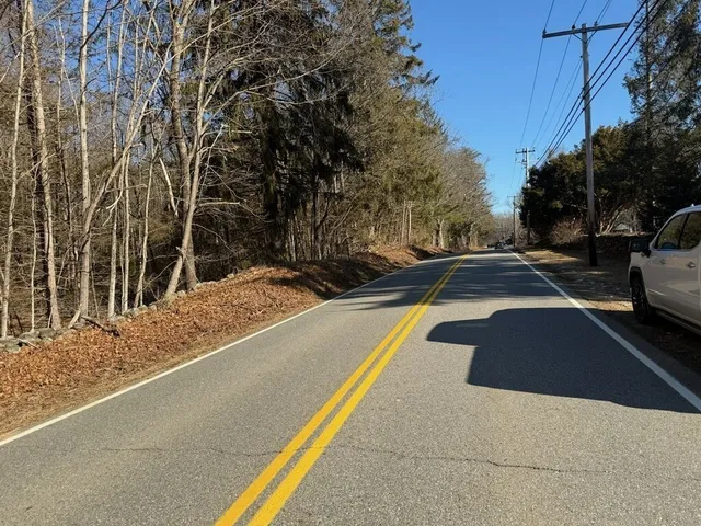a view of a backyard with white house