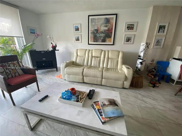 a living room with furniture and a couch