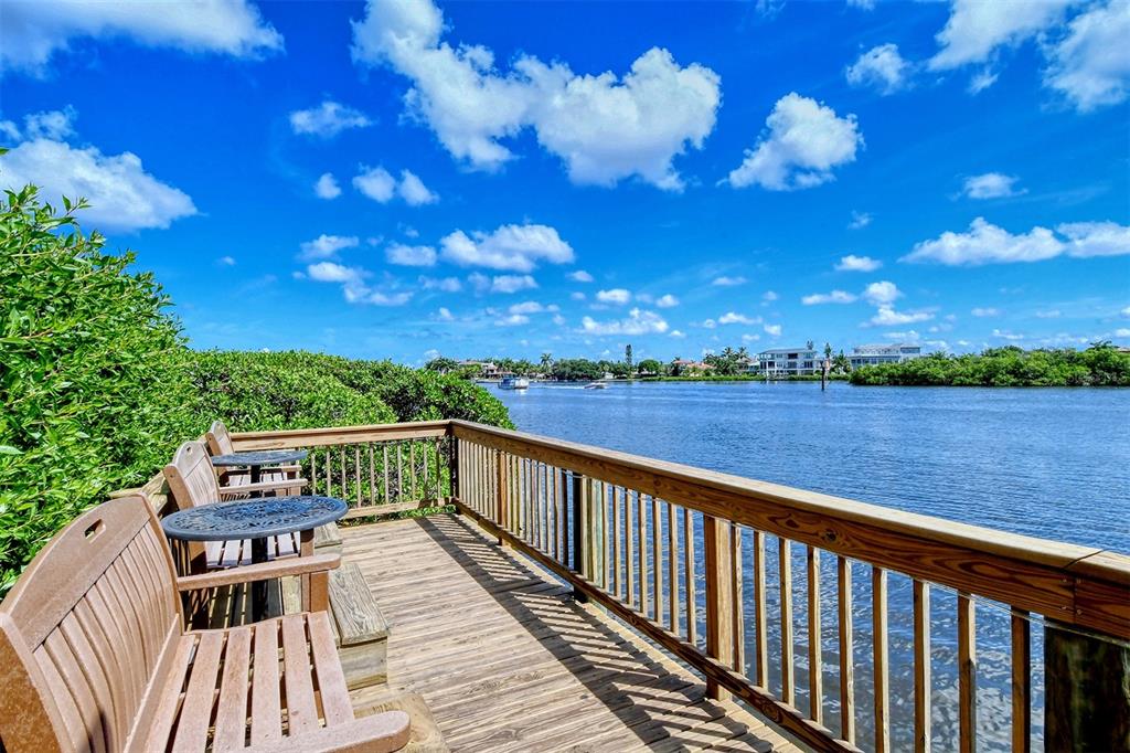 6287 Midnight Pass Road, Unit 103 Sarasota, FL 34242 - Photo 29 of 36 a view of a balcony with wooden floor