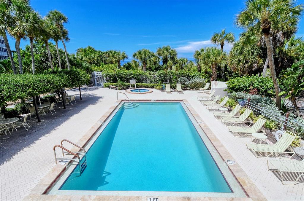 6287 Midnight Pass Road, Unit 103 Sarasota, FL 34242 - Photo 34 of 36 a view of swimming pool with chairs