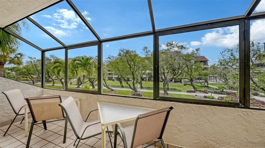 6287 Midnight Pass Road, Unit 103 Sarasota, FL 34242 - Photo 8 of 36 a view of a room with a large window