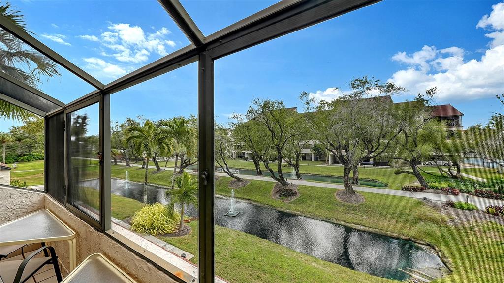 6287 Midnight Pass Road, Unit 103 Sarasota, FL 34242 - Photo 9 of 36 a view of a back yard