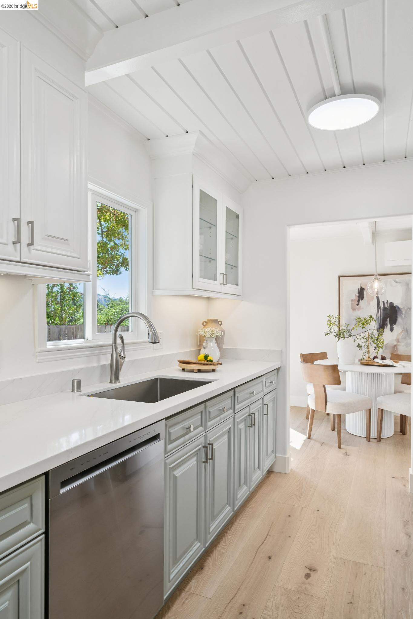 1321 Sunset Loop Lafayette, CA 94549 - Photo 10 of 49 Two-toned cabinetry with light countertops, stainless steel sink, wood-finish flooring, and a paneled ceiling with recessed lighting