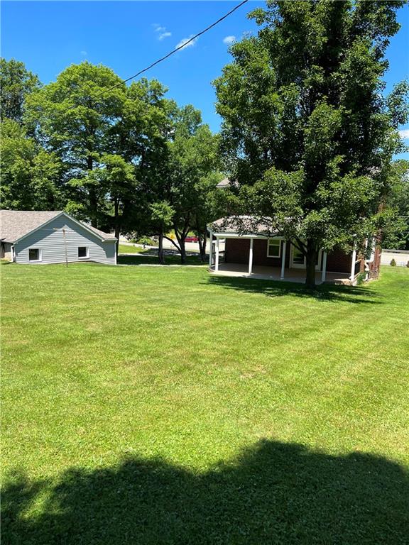 104 Bish Road Butler, PA 16002 - Photo 4 of 20 a view of a swimming pool with a yard