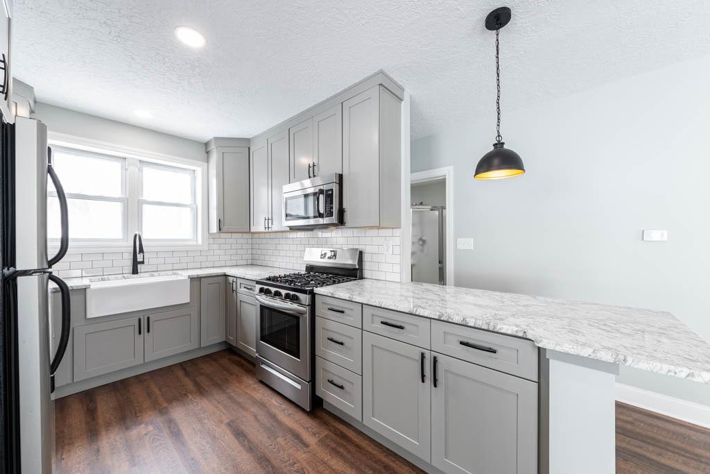104 Bish Road Butler, PA 16002 - Photo 5 of 20 a kitchen with white cabinets and appliances