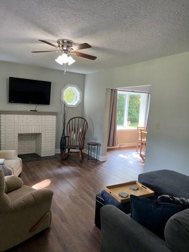 104 Bish Road Butler, PA 16002 - Photo 10 of 20 a living room with furniture a fireplace and a flat screen tv