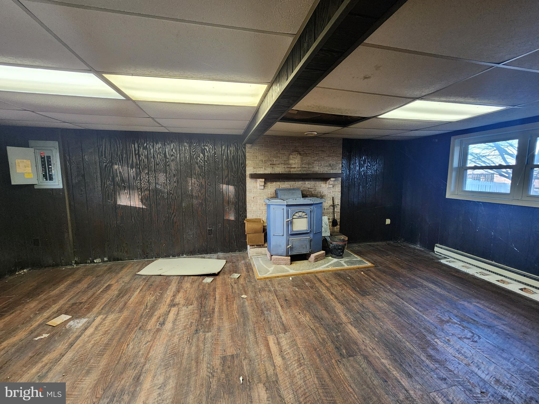 3734 Elizabethtown Road Manheim, PA 17545 - Photo 29 of 34 a view of empty room with wooden floor and fireplace