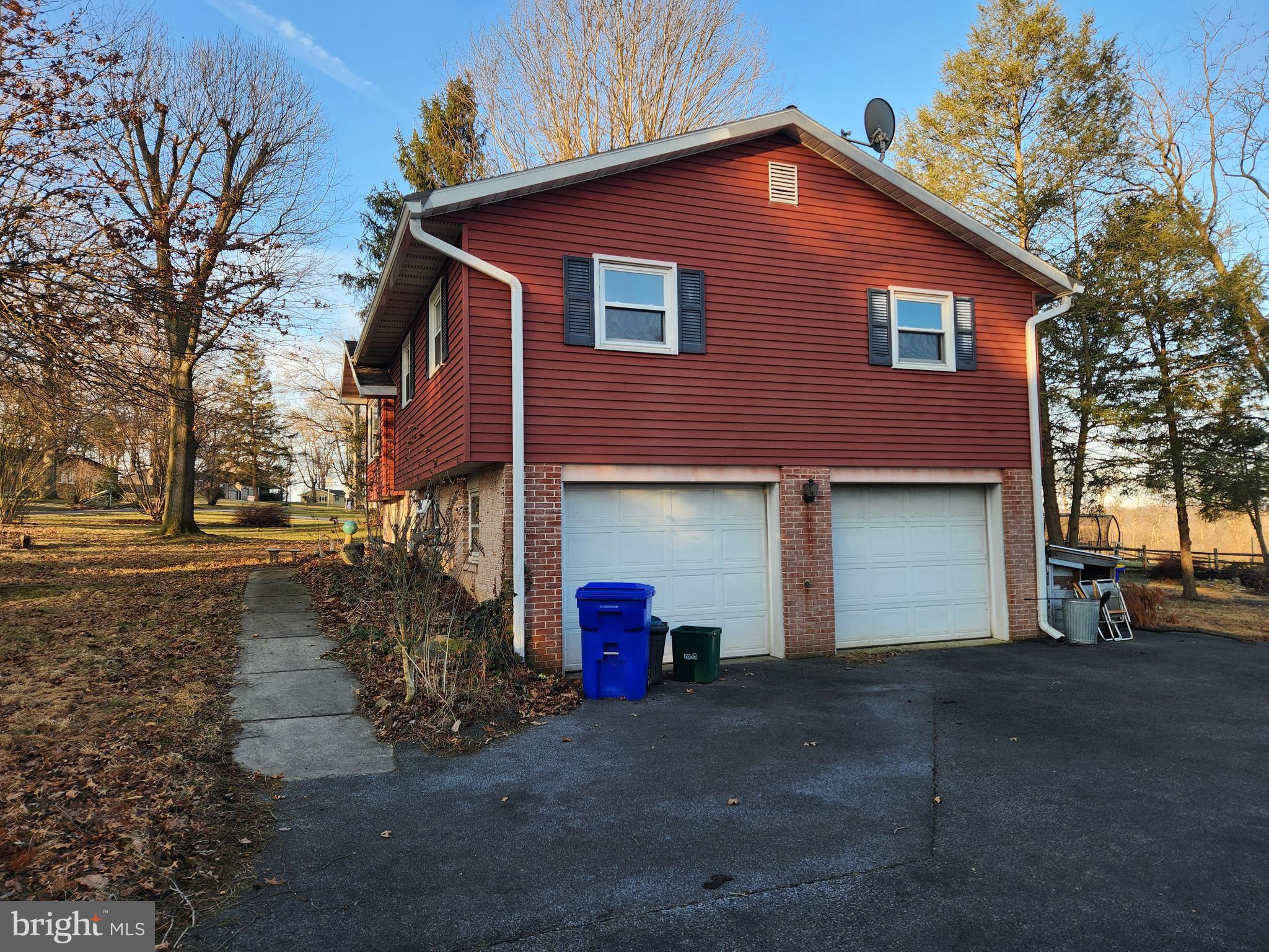3734 Elizabethtown Road Manheim, PA 17545 - Photo 5 of 34 a front view of a house with a yard