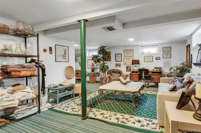a view of a livingroom with furniture and a rug