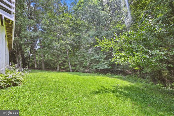 115 Kingbrook Road Linthicum Heights, MD 21090 - Photo 12 of 72 a view of a trees with a yard