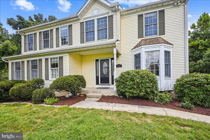 115 Kingbrook Road Linthicum Heights, MD 21090 - Photo 15 of 72 a front view of a house with a yard