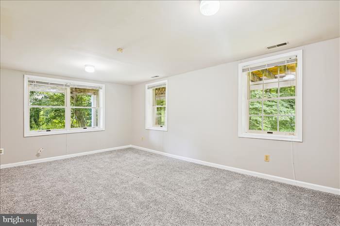 115 Kingbrook Road Linthicum Heights, MD 21090 - Photo 17 of 72 an empty room with windows