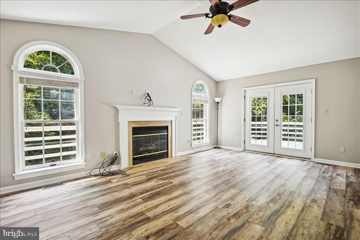 115 Kingbrook Road Linthicum Heights, MD 21090 - Photo 27 of 72 a view of an empty room with a window and wooden floor