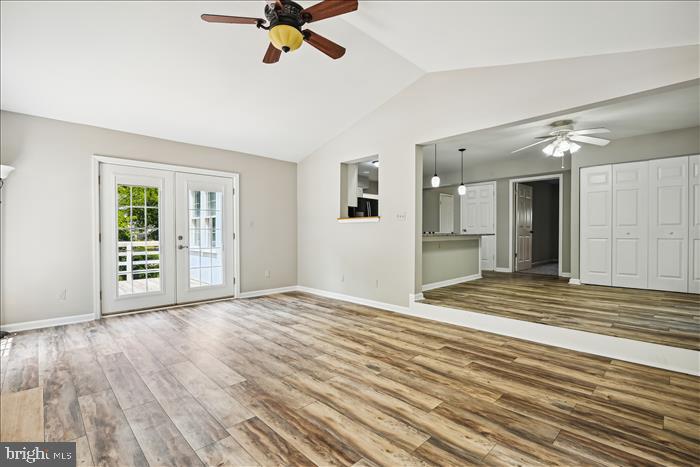115 Kingbrook Road Linthicum Heights, MD 21090 - Photo 28 of 72 a view of an empty room with wooden floor and a window