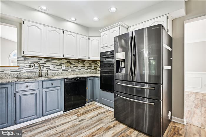 115 Kingbrook Road Linthicum Heights, MD 21090 - Photo 30 of 72 a kitchen with granite countertop a refrigerator stove and oven