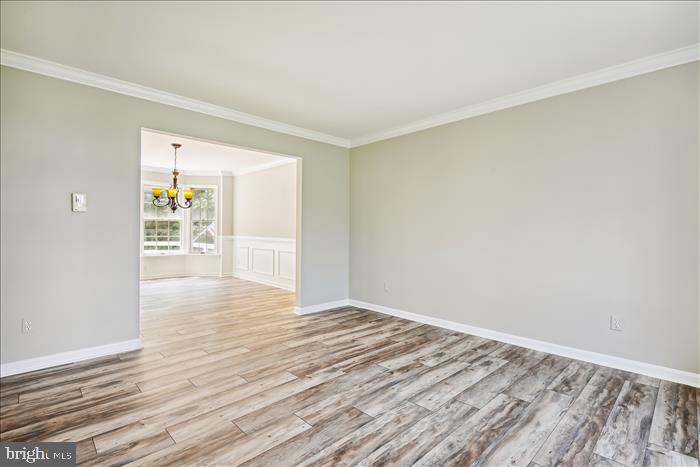 115 Kingbrook Road Linthicum Heights, MD 21090 - Photo 38 of 72 wooden floor in an empty room with a window