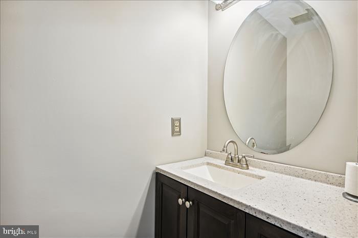 115 Kingbrook Road Linthicum Heights, MD 21090 - Photo 39 of 72 a bathroom with a sink and a mirror