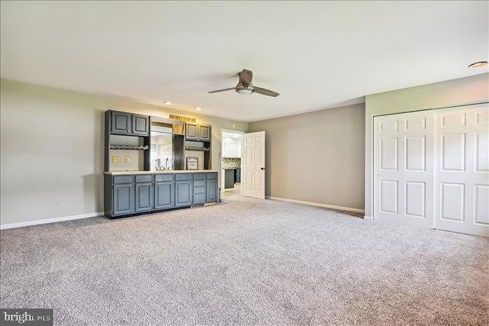 115 Kingbrook Road Linthicum Heights, MD 21090 - Photo 44 of 72 a view of an empty room with cabinet and windows