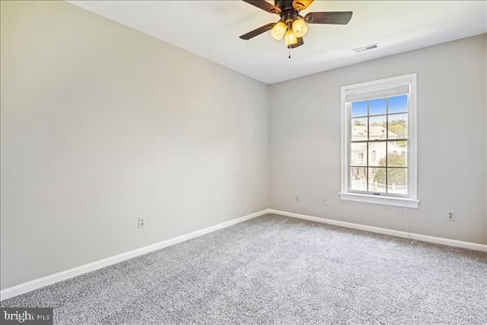 115 Kingbrook Road Linthicum Heights, MD 21090 - Photo 51 of 72 an empty room with a window and a fan