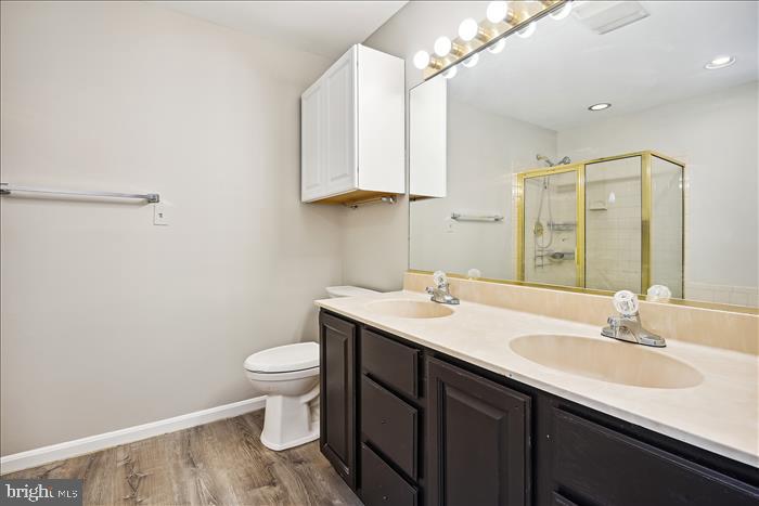 115 Kingbrook Road Linthicum Heights, MD 21090 - Photo 58 of 72 a bathroom with a sink toilet and a mirror