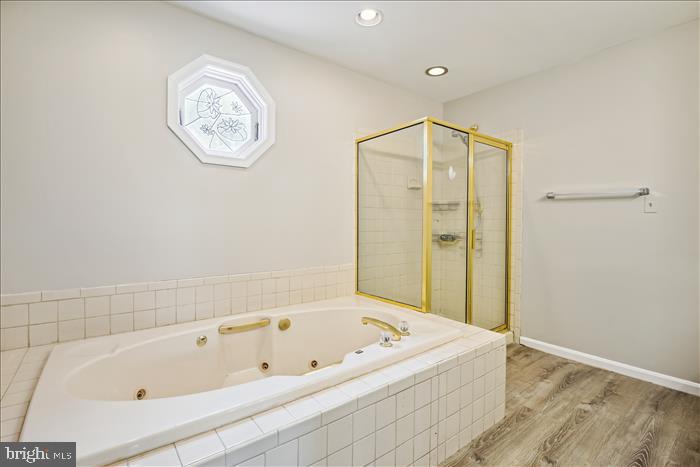 115 Kingbrook Road Linthicum Heights, MD 21090 - Photo 64 of 72 a bathroom with a bathtub and a shower