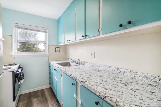 a kitchen with a sink and a window
