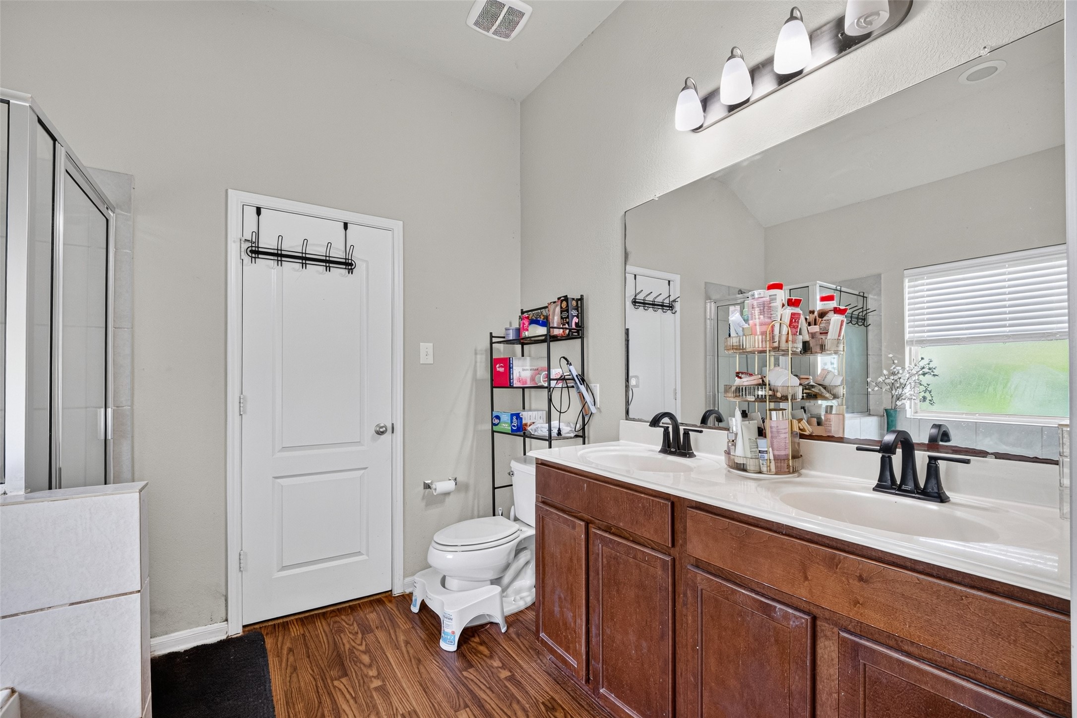 9314 Fuqua Ridge Lane Houston, TX 77075 - Photo 21 of 24 a bathroom with a sink vanity mirror and toilet