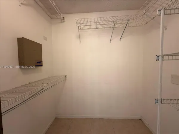 a bathroom with a shower and microwave