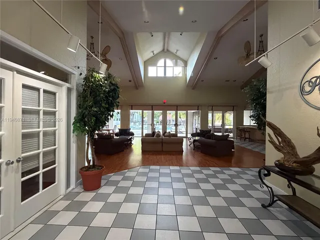 a view of a swimming pool with lounge chairs