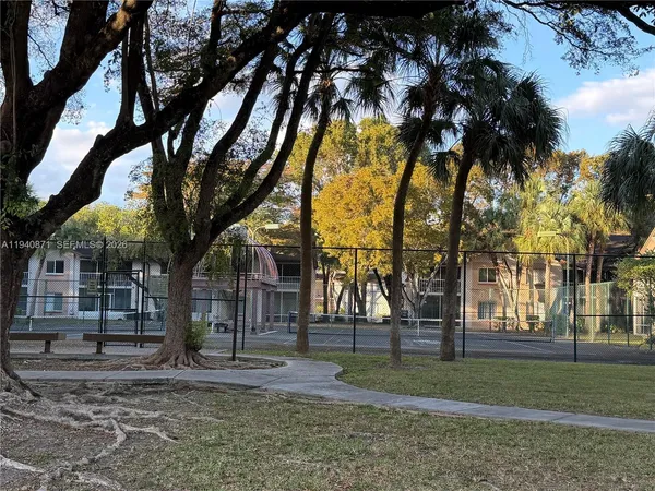 a view of street with parked cars