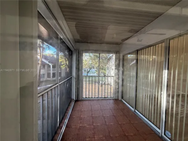 a view of hallway with wooden floor