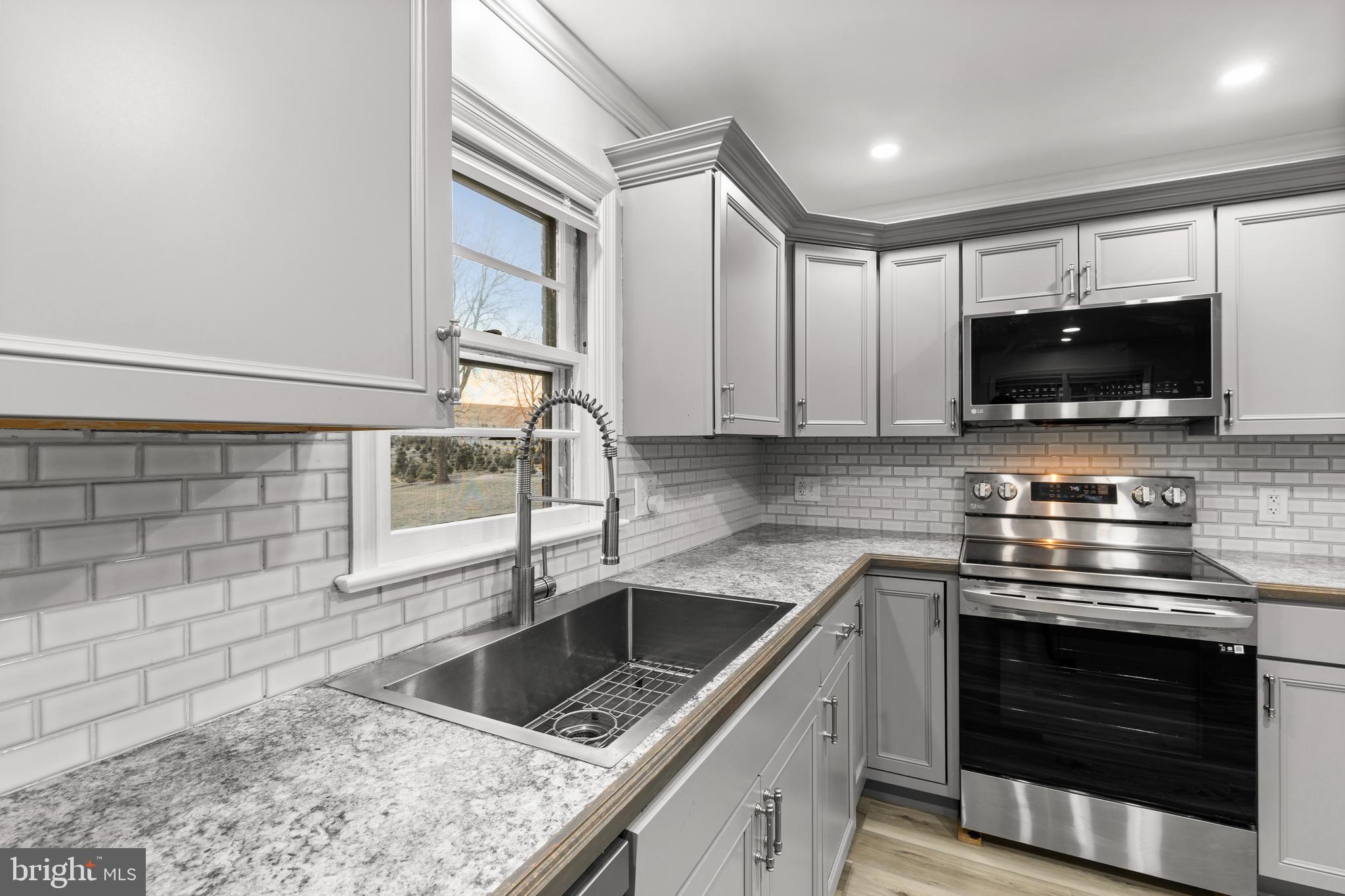 420 Stehman Church Road Millersville, PA 17551 - Photo 11 of 31 a kitchen with a stove and a sink