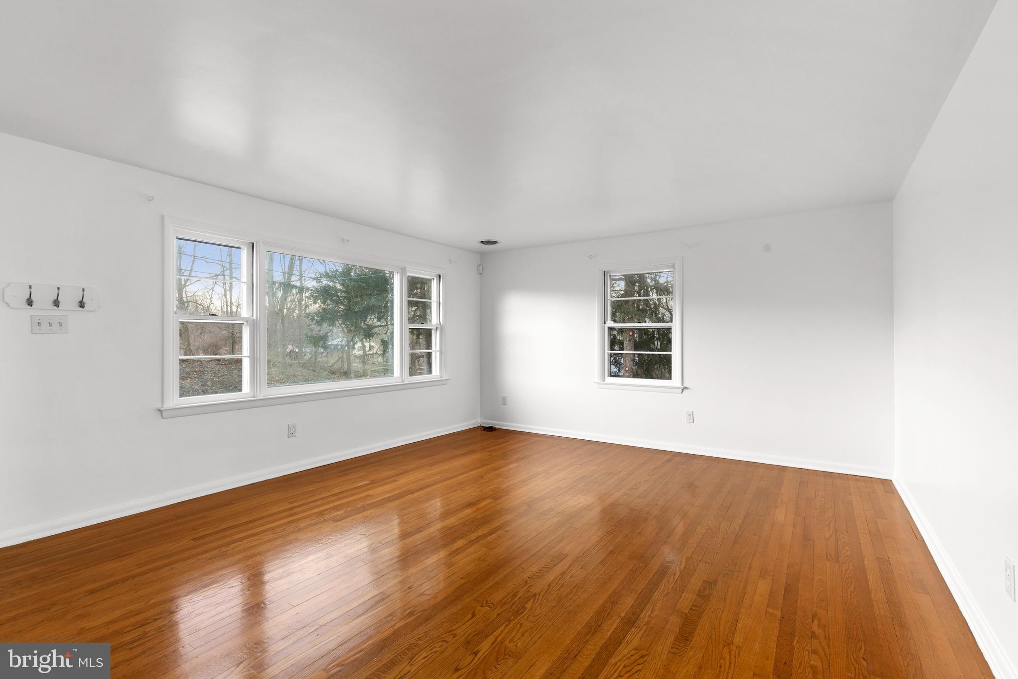 420 Stehman Church Road Millersville, PA 17551 - Photo 19 of 31 a view of an empty room with wooden floor and a window