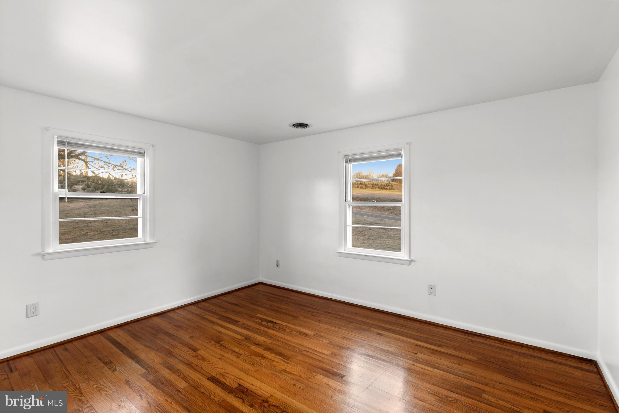 420 Stehman Church Road Millersville, PA 17551 - Photo 22 of 31 a view of empty room with wooden floor and fan