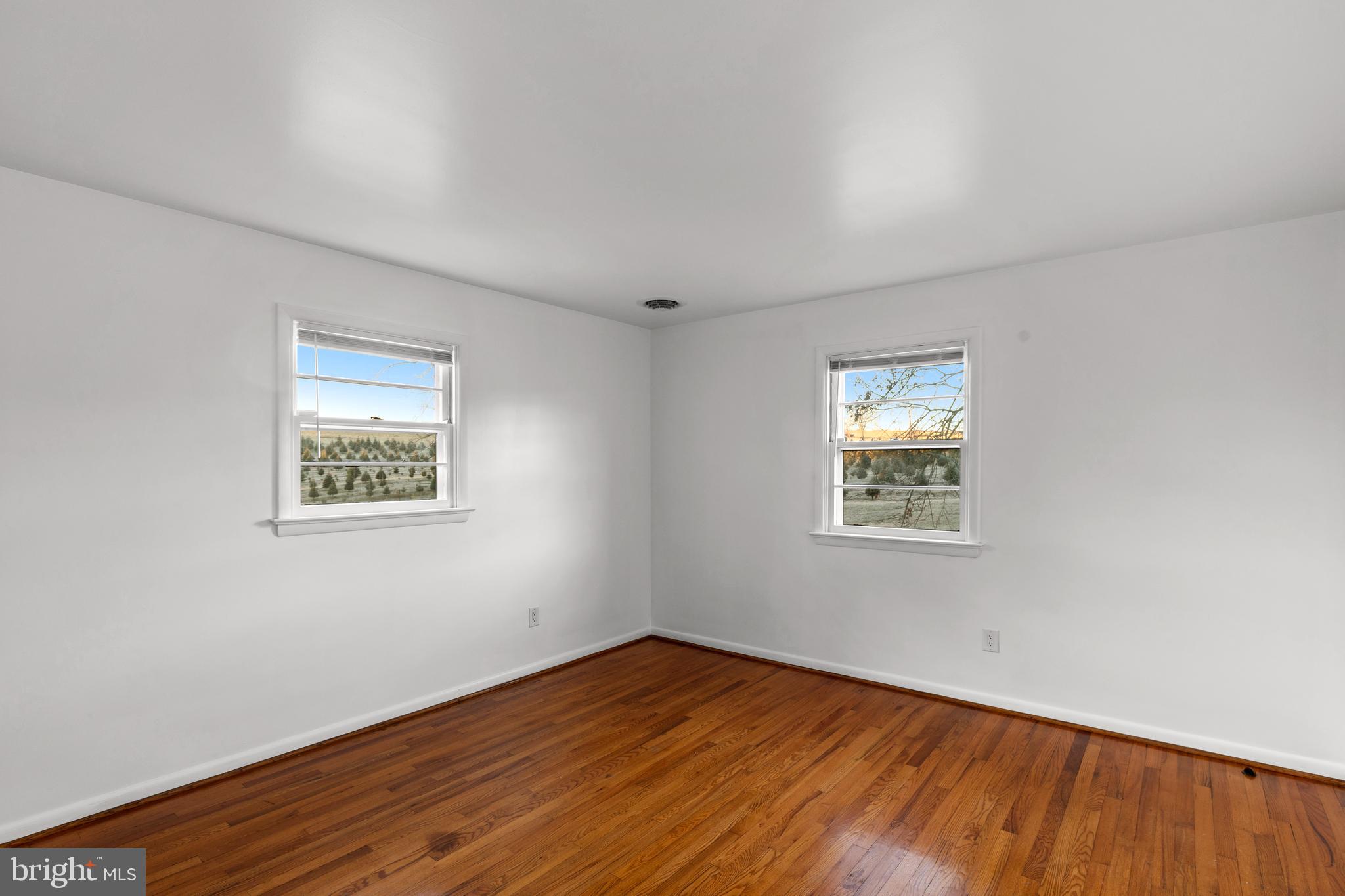 420 Stehman Church Road Millersville, PA 17551 - Photo 24 of 31 a view of an empty room with wooden floor and a window