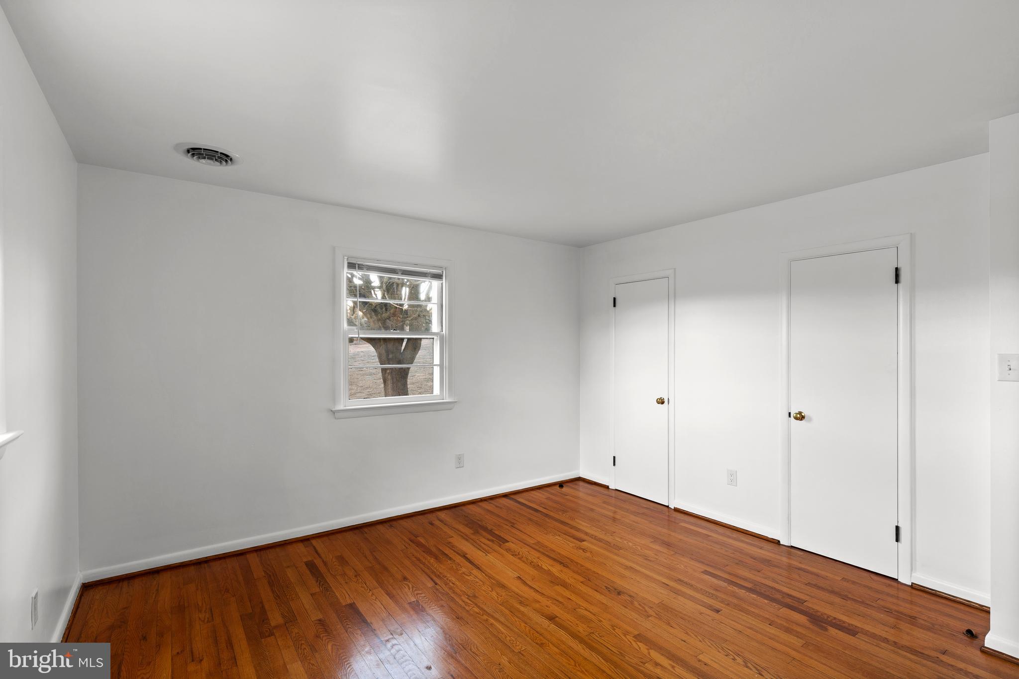 420 Stehman Church Road Millersville, PA 17551 - Photo 25 of 31 a view of an empty room with wooden floor and a window