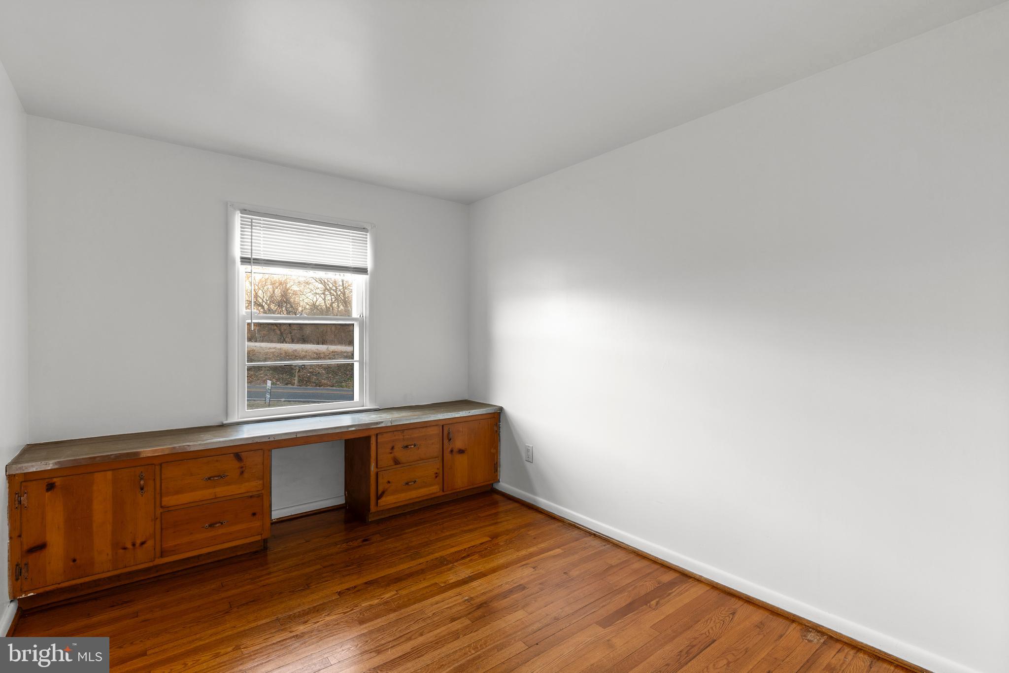 420 Stehman Church Road Millersville, PA 17551 - Photo 26 of 31 a view of an empty room with wooden floor and a window