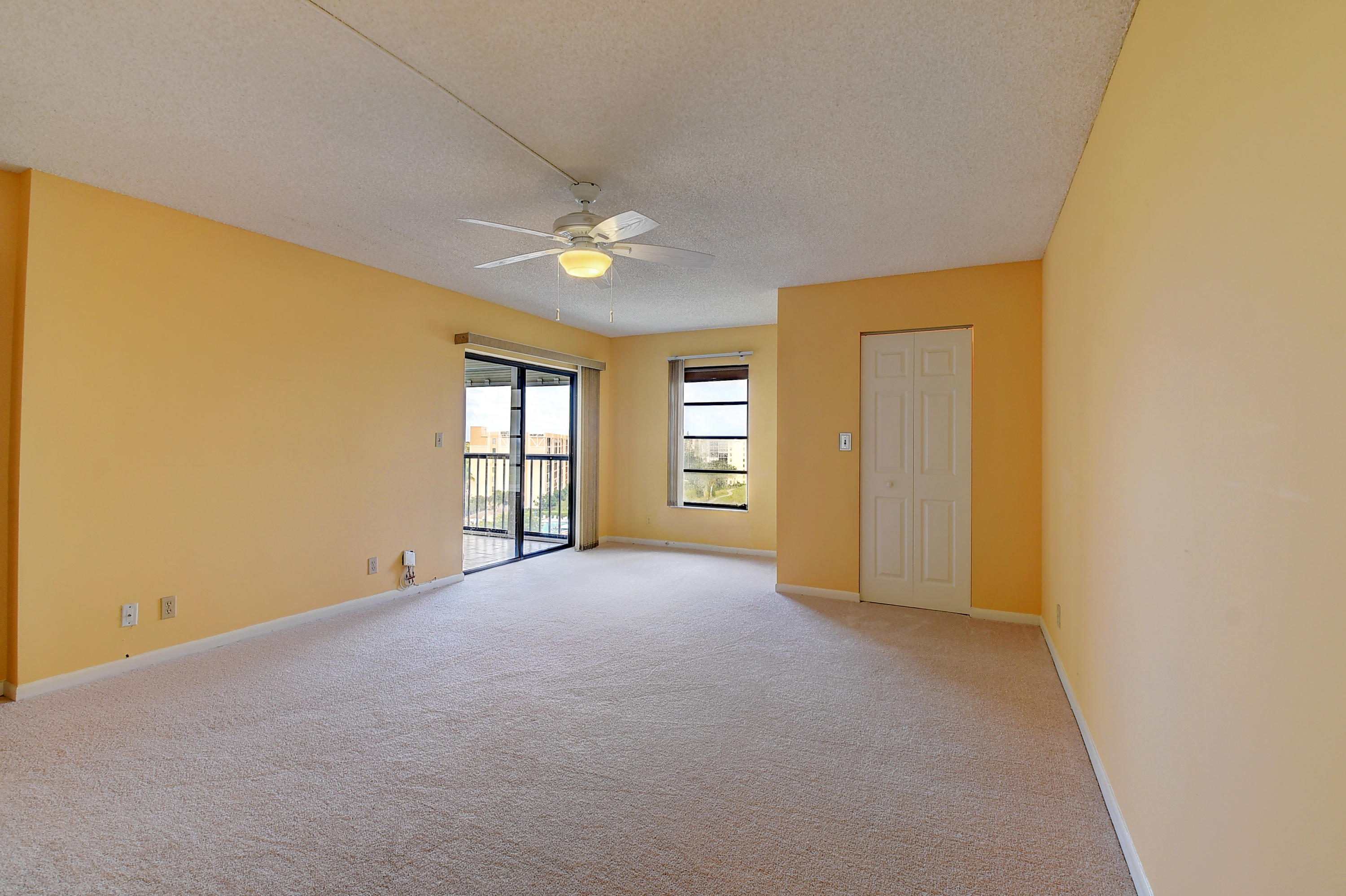 7076 Huntington Lane, Unit 802 Delray Beach, FL 33446 - Photo 12 of 54 Master bedroom with new carpeting