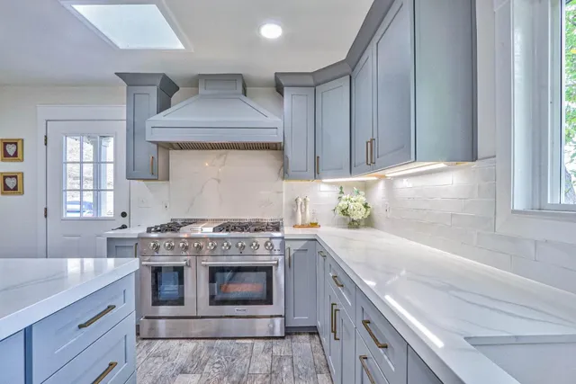 a kitchen with a stove and a sink