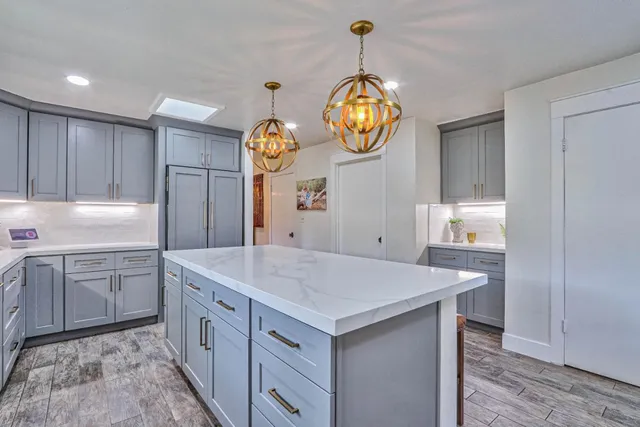 a kitchen with cabinets and window