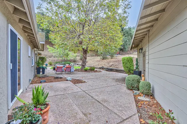 a front view of a house with a yard and a garage