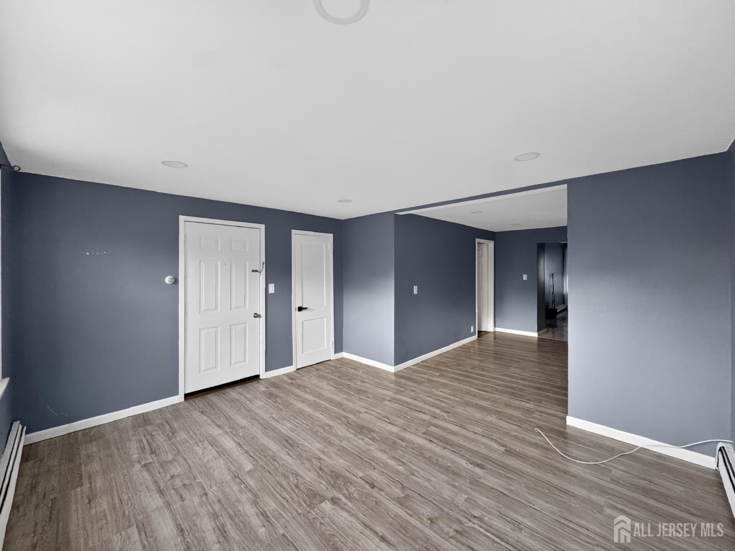 194 High Street, Unit 1 Perth Amboy, NJ 08861 - Photo 3 of 7 a view of empty room with wooden floor