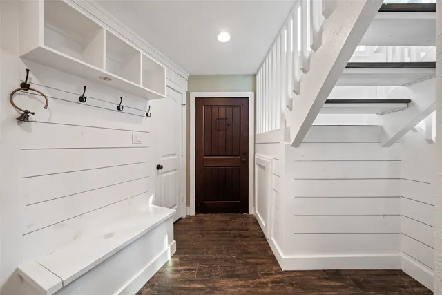 a living room with furniture fireplace and window