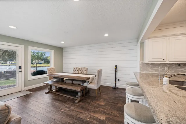 a bathroom with a granite countertop sink vanity and a mirror