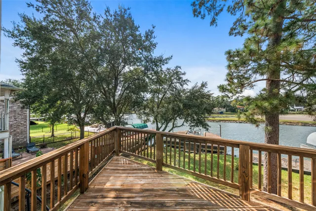 a view of a lake with a house swimming pool and outdoor space