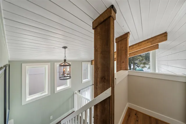a view of a hallway with windows