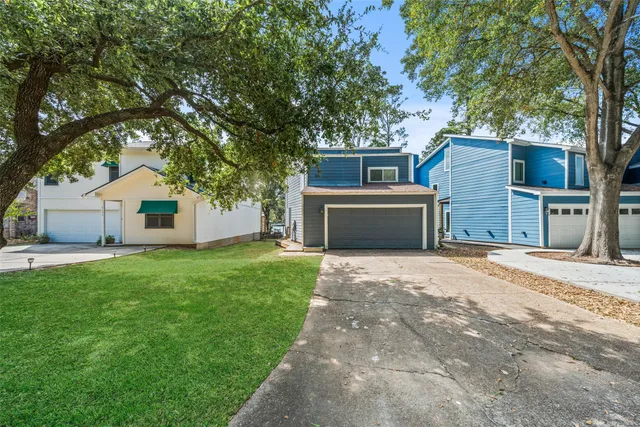 an aerial view of a house with swimming pool having outdoor seating