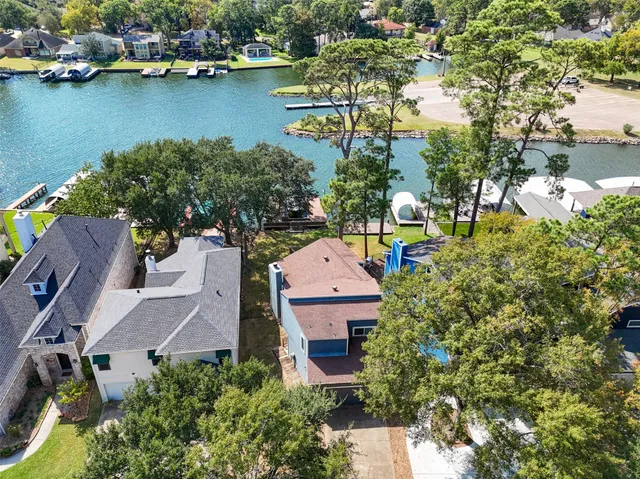an aerial view of a house with a lake view