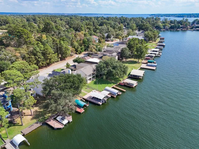 an aerial view of a house with outdoor space swimming pool